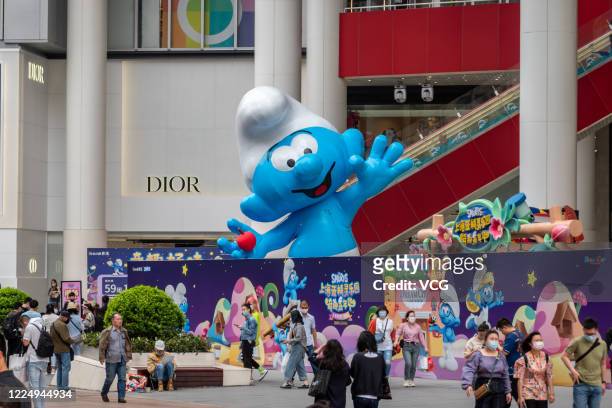 Nearly-10-meter-tall Smurfs sculpture is seen set up at Nanjing Road pedestrian street on May 14, 2020 in Shanghai, China.
