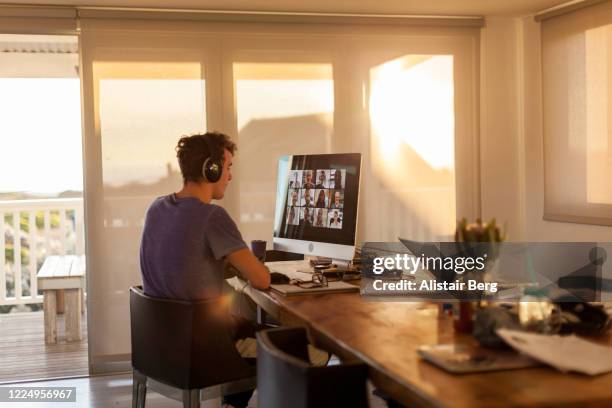 student on a video call from home during lockdown - telewerk stockfoto's en -beelden