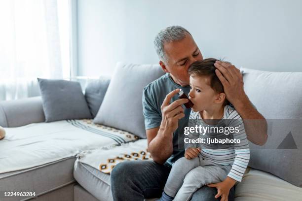 it really is a breath of fresh air - asthma inhaler child stock pictures, royalty-free photos & images