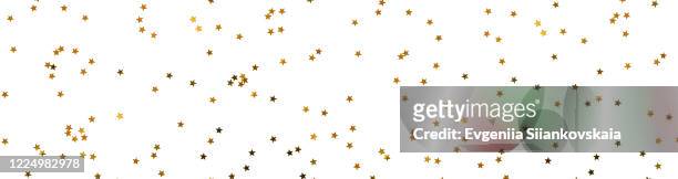 banner made from bunch of gold stars on white background. - fireworks on white stockfoto's en -beelden