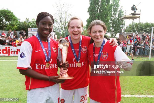 Anita Asante, Gemma Davison and Karen Carney of Arsenal with the Womens UEFA Cup Trophy after the Womens UEFA Cup Final 2nd leg Between Arsenal Women...