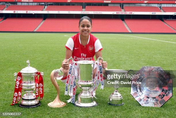 Alex Scott of Arsenal with the Womens FA Cup Trophy, Womens UEFA Cup Trophy, Womens League Cup Trophy, Womens Premier League Trophy and the Womens...
