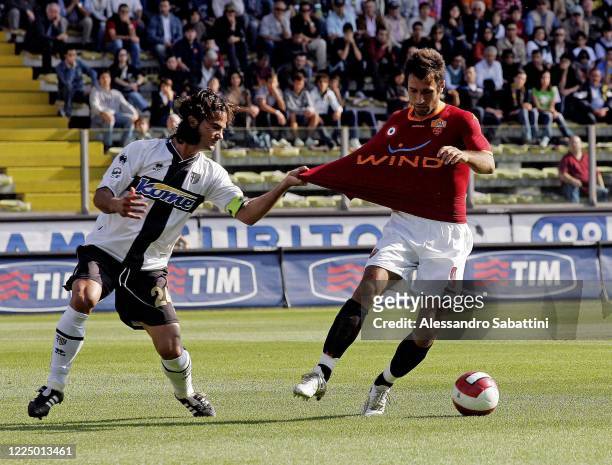 Fernando Couto of Parma Calcio competes for the ball with Mirko Vucinic of AS Roma during the Serie A match between Parma Calcio and AS Roma at...