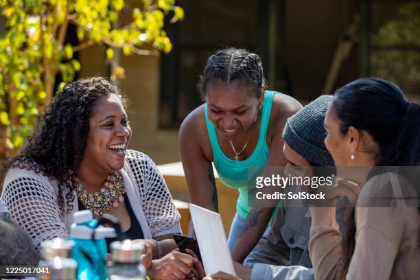 tutoring outdoors - minority groups stock pictures, royalty-free photos & images