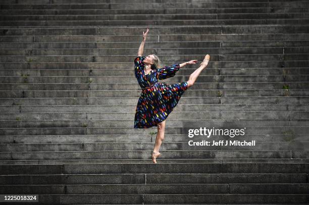 Estonian freelance ballet dancer and choreographer, Eve Mutso performs her daily fitness routine near her home Charing Cross on May 15, 2020 in...