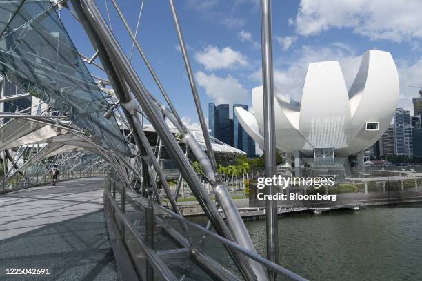The Artscience Museum, right, is seen from the Helix Bridge by Marina Bay in Singapore on Monday, July 6, 2020. Prime Minister Lee Hsien Loong vowed...