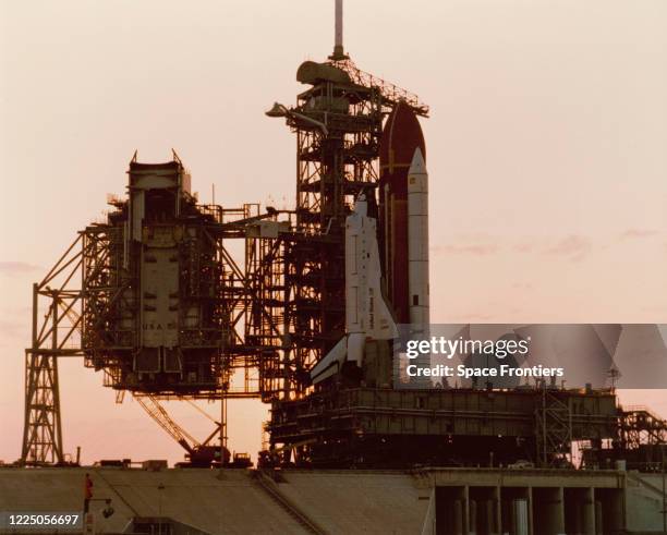 The Space Shuttle Challenger, its two solid rocket booster and external Fuel Tank sit on Launch Pad 39A at the Kennedy Space Center on the evening of...