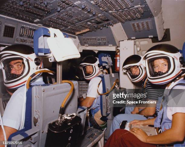 Mission STS-7 crew training, wearing helmets, in the shuttle mission simulator , US, 23rd May 1983; they are Astronauts Robert L Crippen, crew...