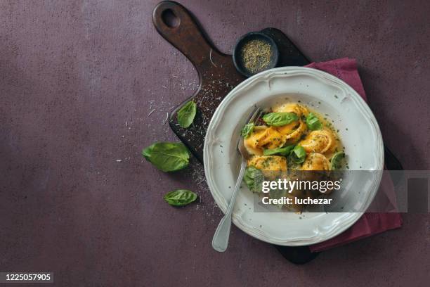 pork and beef tortellini with butter sauce - tortellini stock pictures, royalty-free photos & images