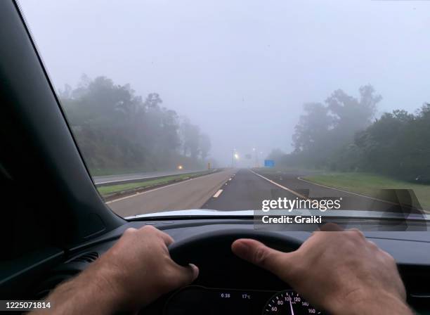 point of view of a driver on a foggy day - driving in fog stock pictures, royalty-free photos & images