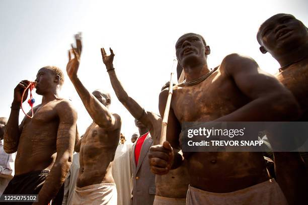 Members of the Mundari tribe from Central Equatoria attend the final of Sudan's first commercial wrestling league between their tribe and the Dinka...