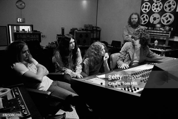 Lynyrd Skynyrd members Ronnie Van Zant, Gary Rossington and Allen Collins work with producer Al Kooper on "Pronounced Lynyrd Skynyrd" with engineer...