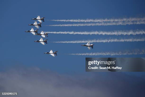 The United States Air Force Thunderbirds do a fly over in solidarity with healthcare and frontline workers as the coronavirus global pandemic...