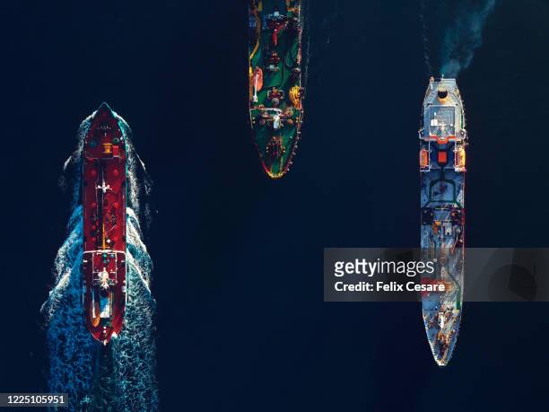 aerial top view of a busy harbour. large commercial ships cruising in the port - ship stock-fotos und bilder