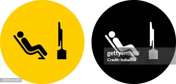 man watching tv icon - looking at multiple monitors stock illustrations
