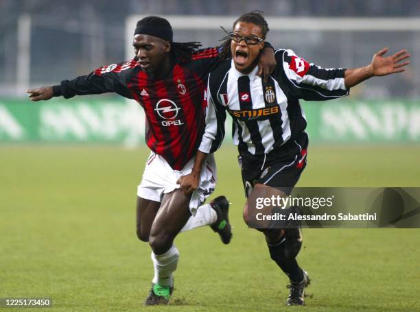 Clarence Seedorf of AC Milan competes for the ball with Edgar Davids of Juventus during the Serie A match between AC Milan and Juvntus at stadio...