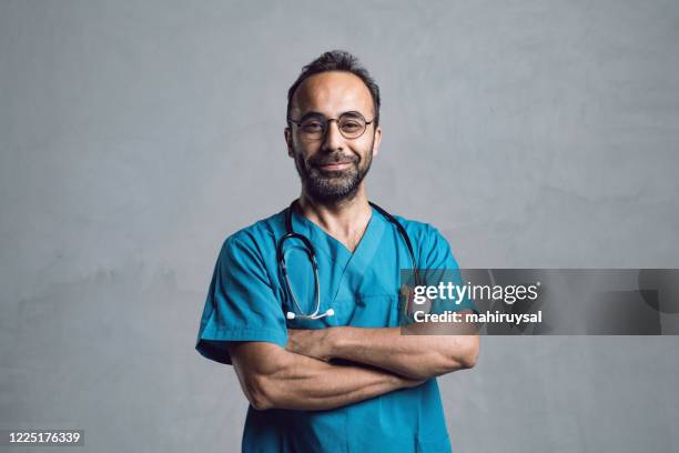 handsome doctor - turkish ethnicity stock pictures, royalty-free photos & images