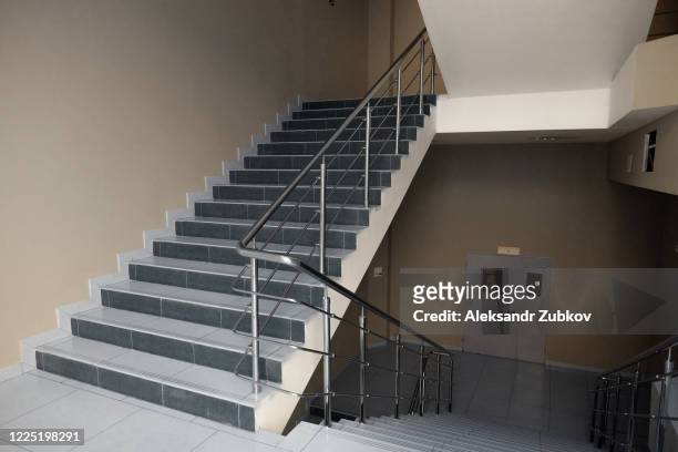 an empty staircase in a college, school, office building, or shopping center. - school building ストックフォトと画像