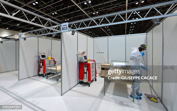 Cleaner sanitise rooms at the temporary COVID-19 hospital built in downtown Dubai in the United Arabic Emirates, on July 7, 2020.