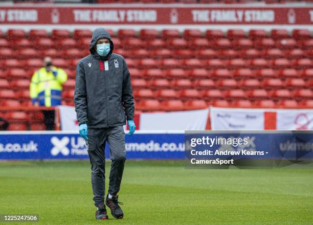 Nottingham Forest's groundstaff wearing PPE during the Sky Bet Championship match between Nottingham Forest and Fulham at City Ground on July 7, 2020...