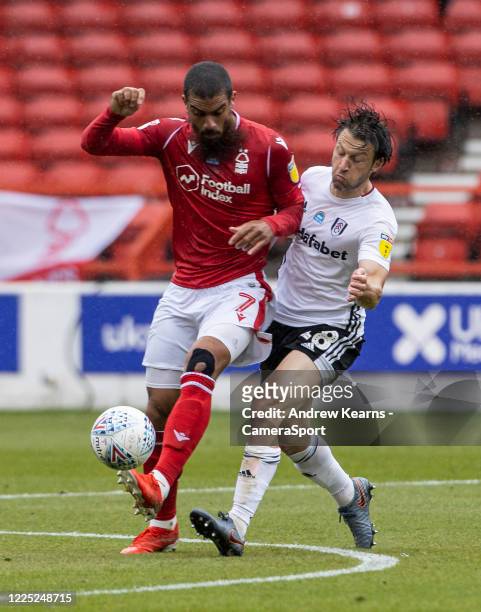 Nottingham Forest's Lewis Grabban competing with Fulham's Harry Arter during the Sky Bet Championship match between Nottingham Forest and Fulham at...