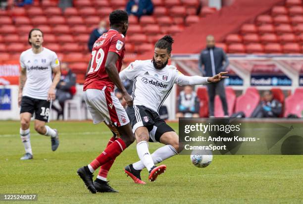Fulham's Michael Hector shoots at goal under pressure from Nottingham Forest's Sammy Ameobi during the Sky Bet Championship match between Nottingham...
