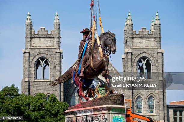 The statue of Confederate General J.E.B. Stuart is removed from Monument Avenue in Richmond, Virginia on July 7, 2020. - Richmond Mayor Levar Stoney...