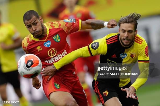 Norwich City's Cuban-born German midfielder Onel Hernandez vies for the ball with Watford's Spanish defender Kiko Femenia during the English Premier...