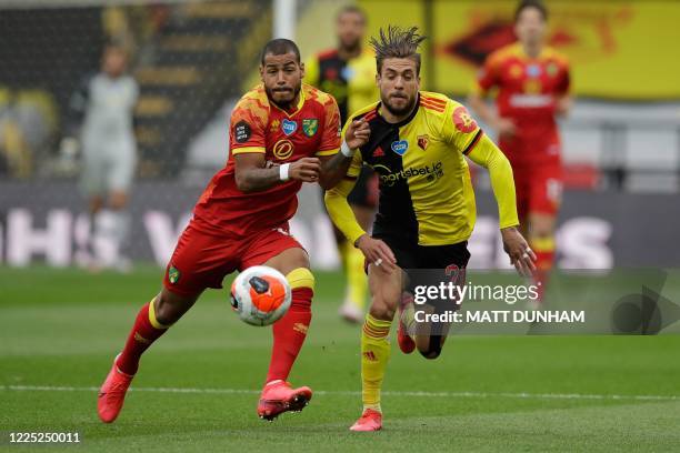 Norwich City's Cuban-born German midfielder Onel Hernandez vies for the ball with Watford's Spanish defender Kiko Femenia during the English Premier...