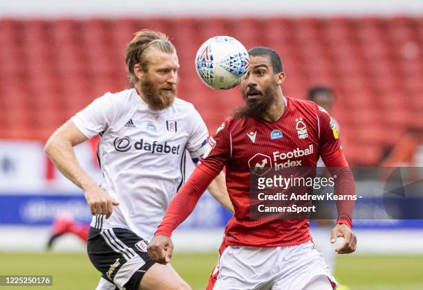 Nottingham Forest's Lewis Grabban competing with Fulham's Tim Ream during the Sky Bet Championship match between Nottingham Forest and Fulham at City...