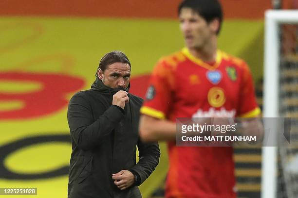 Norwich City's German head coach Daniel Farke reacts as he walks on the pitch after losing the English Premier League football match between Watford...