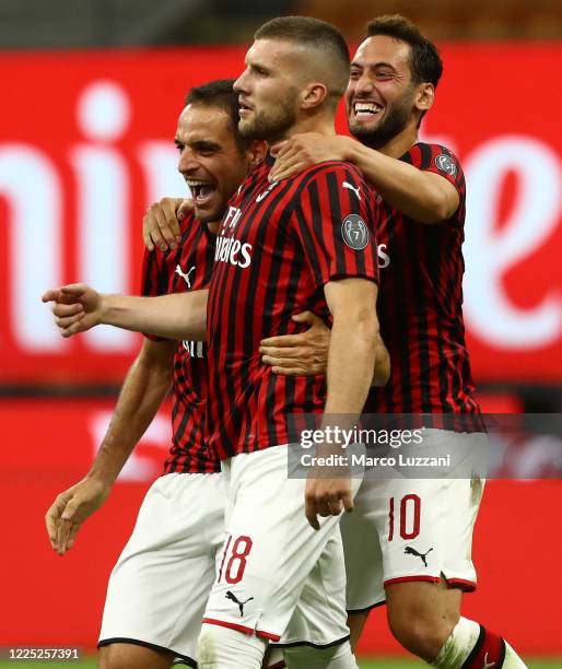 Ante Rebic of AC Milan celebrates his goal with his team-mates Hakan Calhanoglu and Giacomo Bonaventura during the Serie A match between AC Milan and...