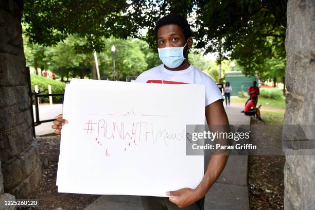 Social media personality Ayoo Travv attends Ahmaud Arbery Jog For Justice during the COVID-19 pandemic at Piedmont Park on May 16, 2020 in Atlanta,...