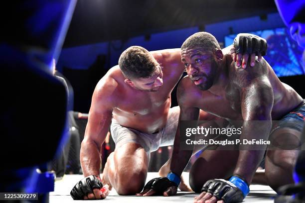 Alistair Overeem of the Netherlands consoles Walt Harris of the United States after their Heavyweight bout during UFC Fight Night at VyStar Veterans...