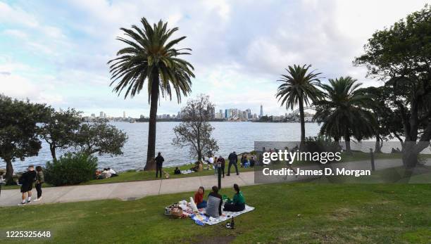 Friends and families gather for picnics at Cremorne Point on May 17, 2020 in Sydney, Australia. Restrictions put in place in response to the COVID-19...