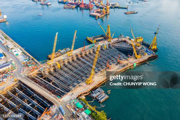 drone view of kai tak cruise terminal in hong kong - reclamation stock pictures, royalty-free photos & images