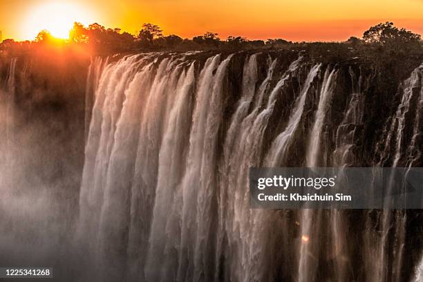 victoria falls zimbabwe - victoria falls sunset stock pictures, royalty-free photos & images