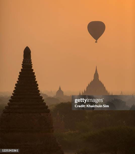sunrise and pagodas in bagan - theravada stock pictures, royalty-free photos & images