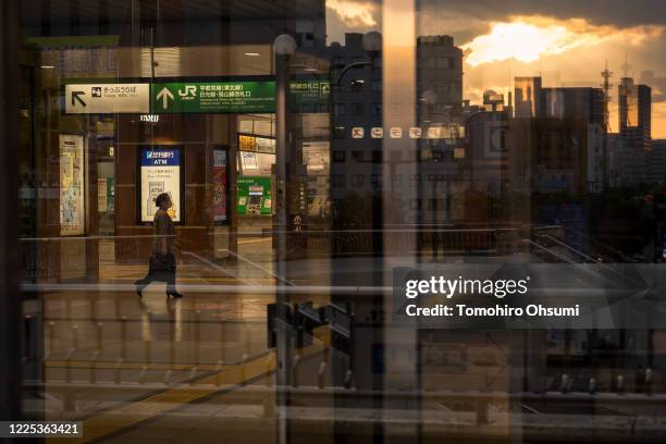 Woman walks through the Utsunomiya train station on May 17, 2020 in Utsunomiya, Tochigi, Japan. Japan's Prime Minister Shinzo Abe announced that the...