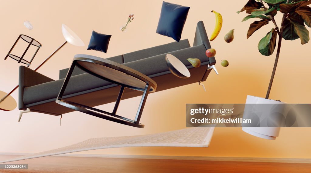 Concept of living room with furniture flying through the air