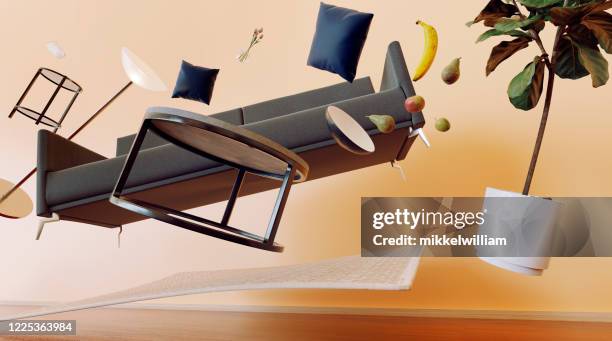 concept of living room with furniture flying through the air - levitating stock pictures, royalty-free photos & images