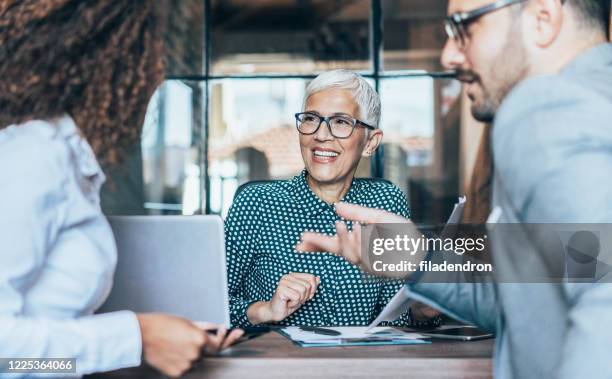 business discussion - ceo speaking stock pictures, royalty-free photos & images