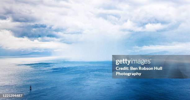 approaching storm - thunderstorm ocean blue stock-fotos und bilder