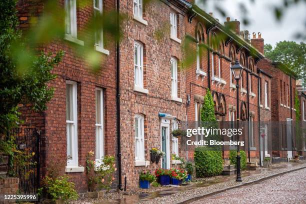 Terraced houses stand on cobbled streets in the historic Moravian settlement in Droylsden, Greater Manchester, U.K., on Tuesday, July 7, 2020. U.K....
