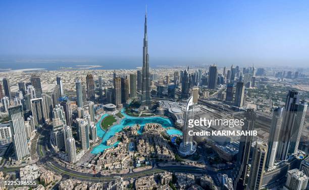 This picture taken on July 8, 2020 shows an aerial view of the Burj Khalifa skyscraper, the tallest structure and building in the world, in the Gulf...