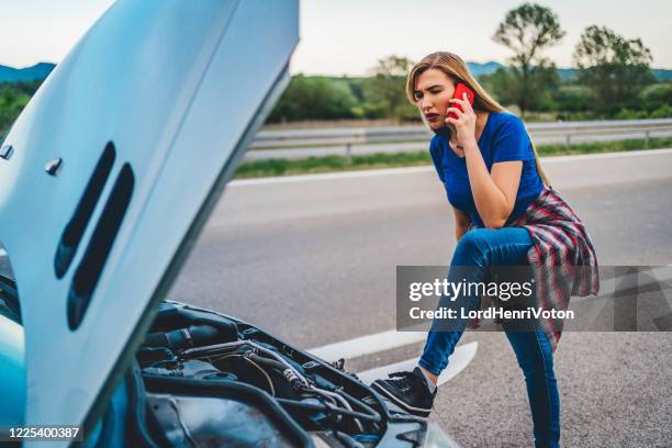 broken car on the road - bad luck stock pictures, royalty-free photos & images