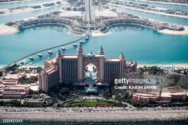 This picture taken on July 8, 2020 shows an aerial view of the Atlantis The Palm, luxury hotel resort located at the apex of the man-made Palm...