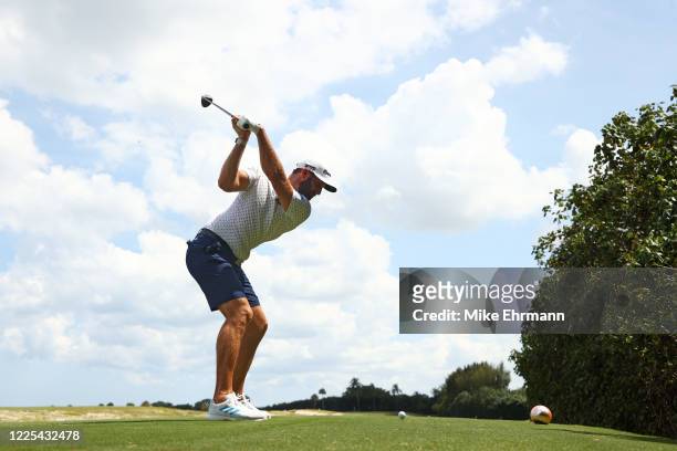 Dustin Johnson of the American Nurses Foundation team plays his shot from the fifth tee during the TaylorMade Driving Relief Supported By...