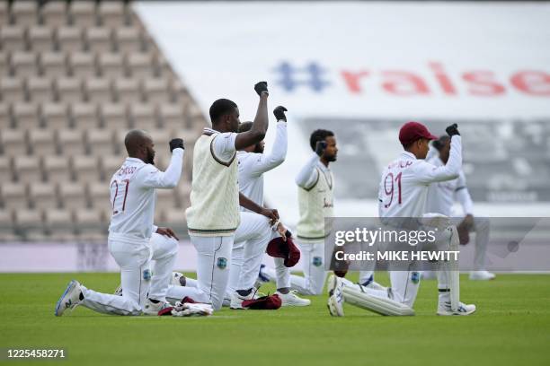 West Indies' players 'take a knee' in support of the Black Lives Matter movement ahead of play on the first day of the first Test cricket match...