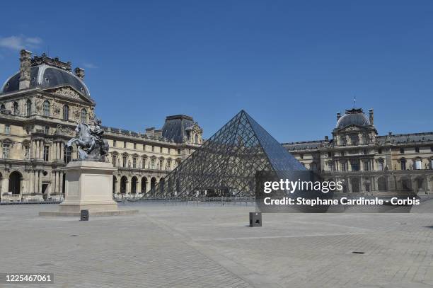 View of the closed "Louvre Museum" and "Pyramide du Louvre" after France eased lockdown measures taken to curb the spread of the COVID-19 pandemic on...